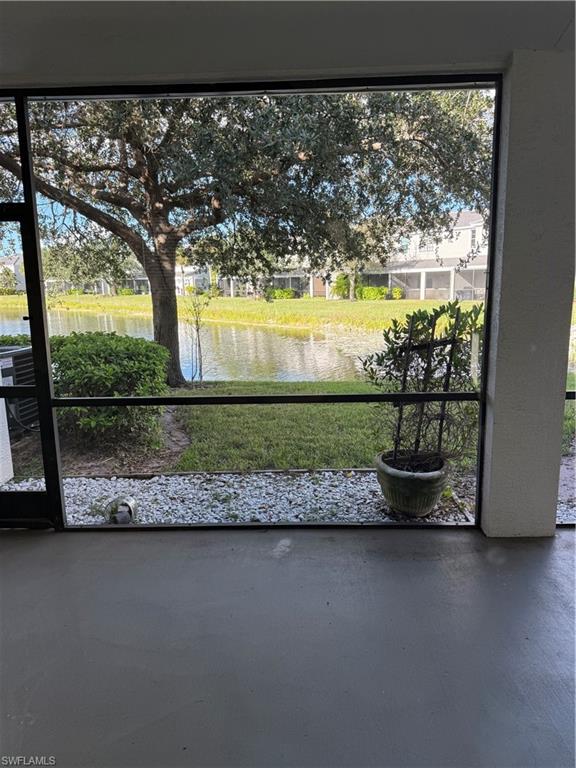 15155 Summit Pl Circle, Unit 232 Naples, FL 34119 - Photo 21 of 27 a view of a porch with a yard