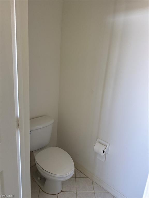15155 Summit Pl Circle, Unit 232 Naples, FL 34119 - Photo 22 of 27 a white toilet sitting next to a shower