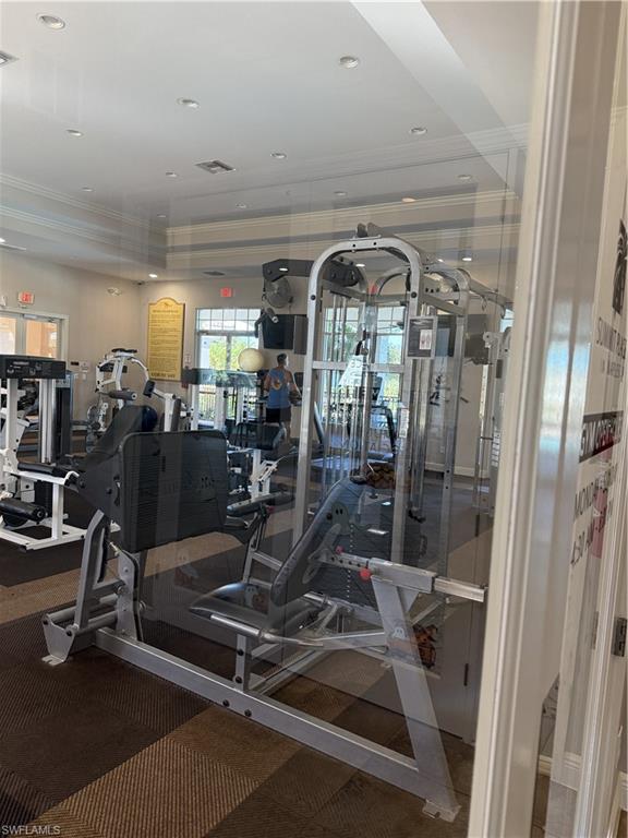 15155 Summit Pl Circle, Unit 232 Naples, FL 34119 - Photo 25 of 27 a view of a room with gym equipment