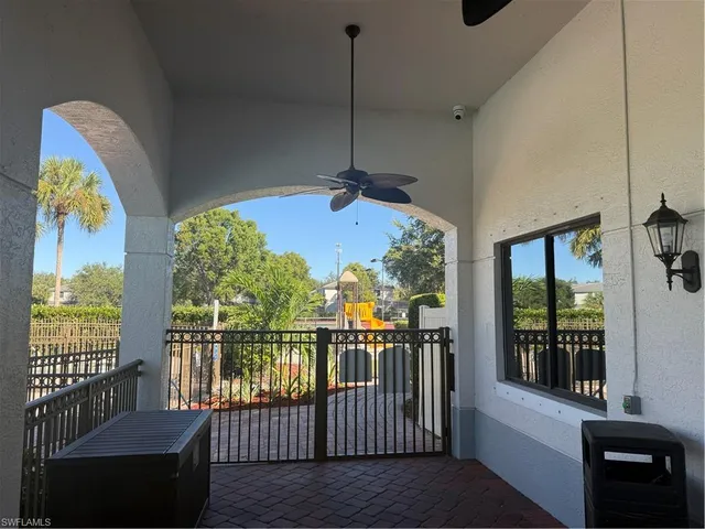 a view of a balcony with furniture