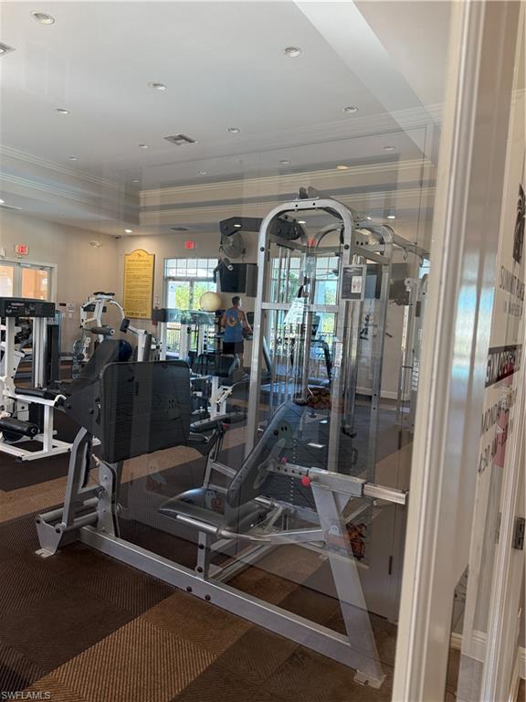 15155 Summit Pl Circle, Unit 232 Naples, FL 34119 - Photo 27 of 27 a view of a room with gym equipment