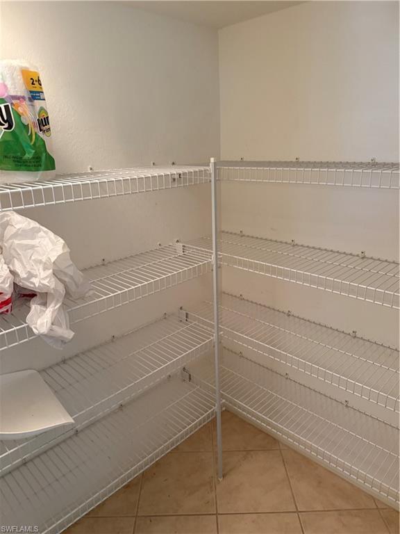 15155 Summit Pl Circle, Unit 232 Naples, FL 34119 - Photo 6 of 27 a bathroom with a bathtub