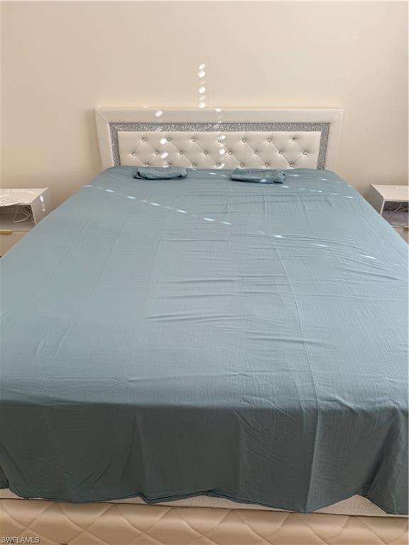 15155 Summit Pl Circle, Unit 232 Naples, FL 34119 - Photo 9 of 27 a view of table and chair