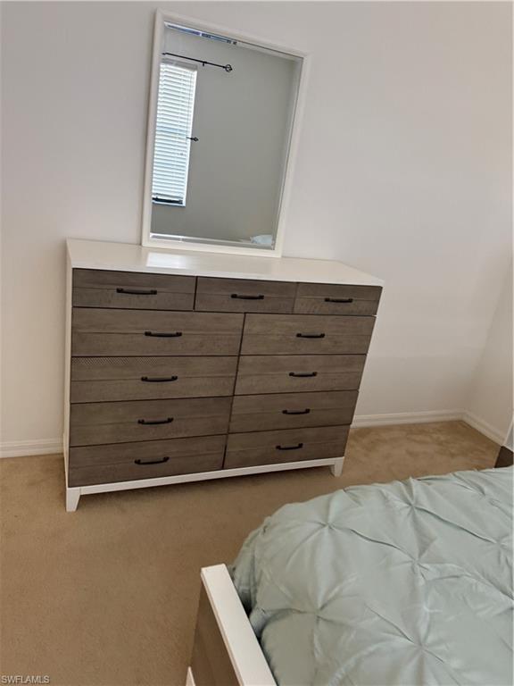 15155 Summit Pl Circle, Unit 232 Naples, FL 34119 - Photo 10 of 27 a view of a dresser