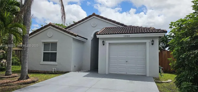 a front view of a house with a garage