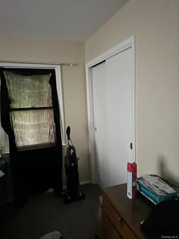 a room with a window and gym equipment