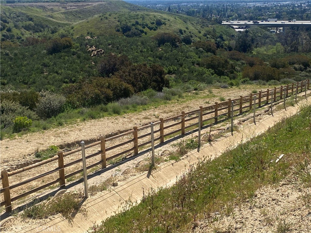 2 Coya Trail Chatsworth, CA 91311 - Photo 5 of 18 a view of a yard with wooden fence