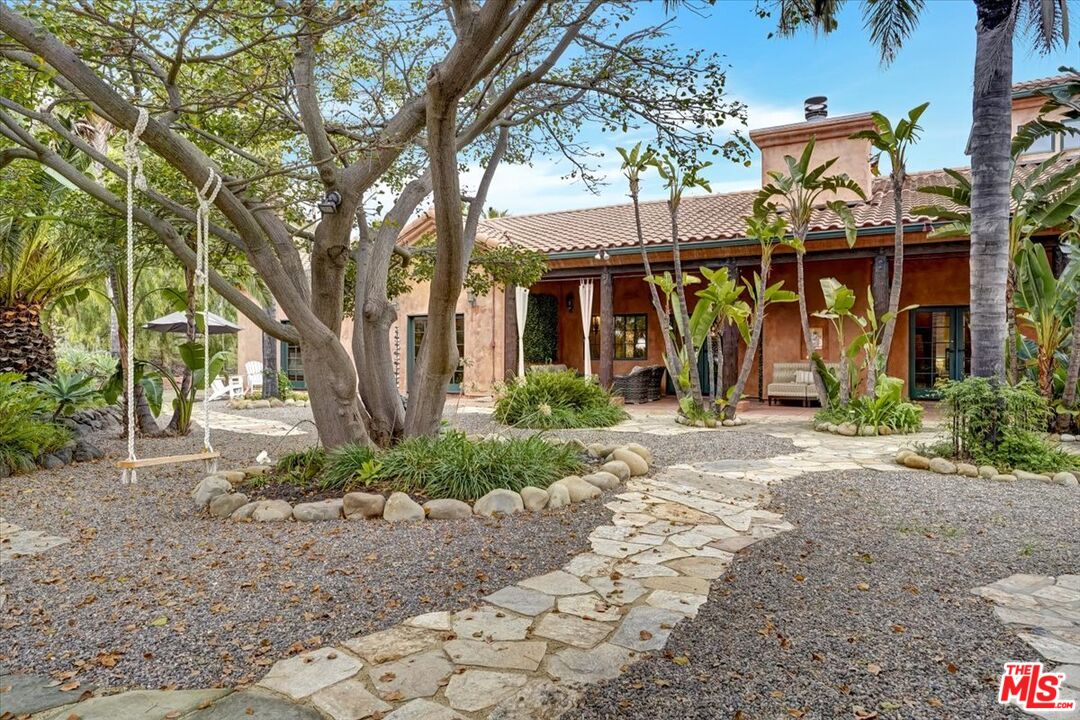 1351 Decker Road Malibu, CA 90265 - Photo 13 of 54 a front view of a house with garden