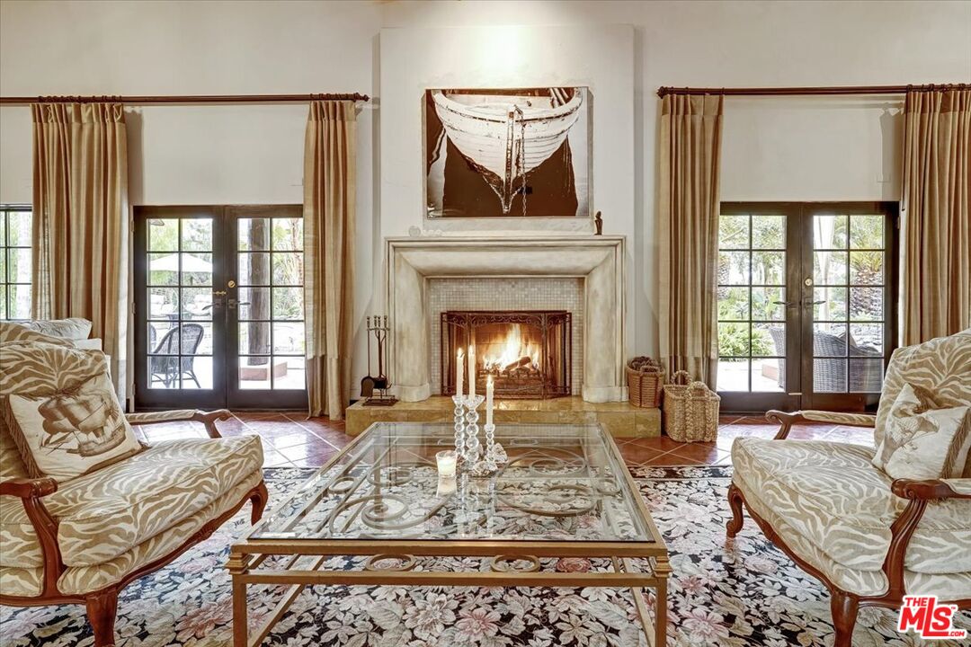 1351 Decker Road Malibu, CA 90265 - Photo 28 of 54 a living room with furniture windows and a fireplace