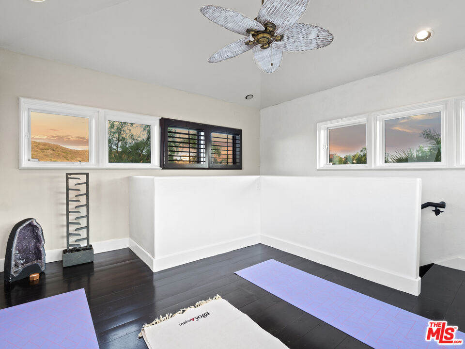 1351 Decker Road Malibu, CA 90265 - Photo 38 of 54 a living room with furniture and wooden floor