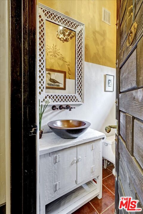1351 Decker Road Malibu, CA 90265 - Photo 42 of 54 a bathroom with a sink and a mirror