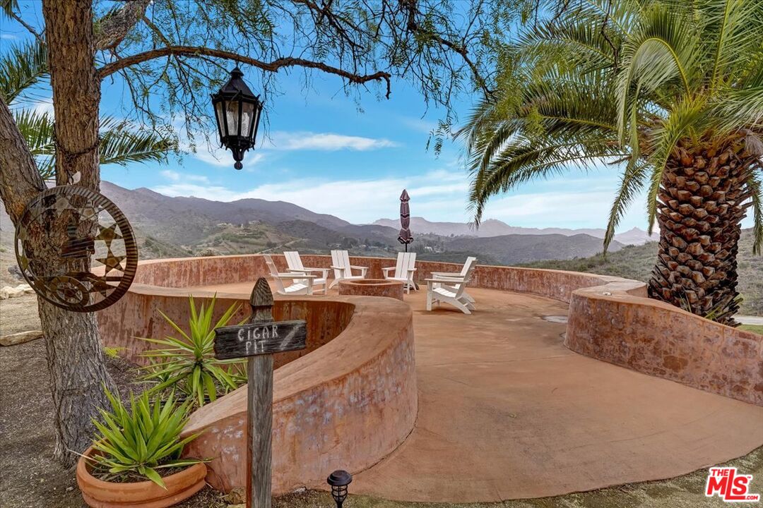 1351 Decker Road Malibu, CA 90265 - Photo 46 of 54 a view of balcony with wooden floor and a potted plant