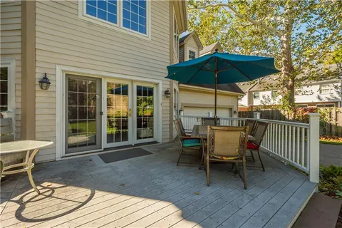 a view of a dining tables and chairs in the balcony