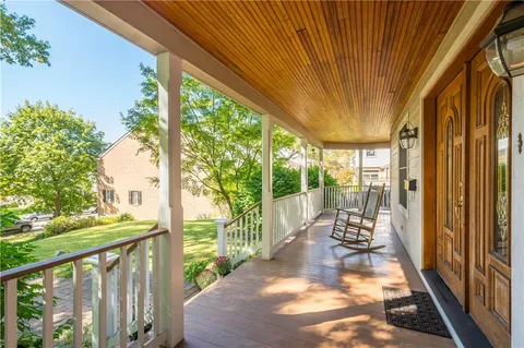 a view of porch with a furniture