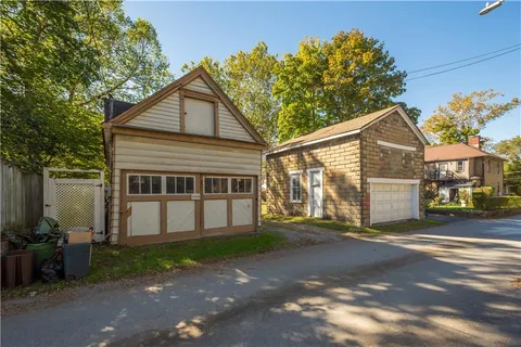 an aerial view of house with yard and mountain view in back
