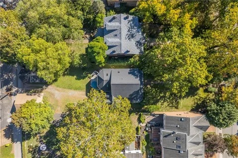 a view of a house with a tree in the background