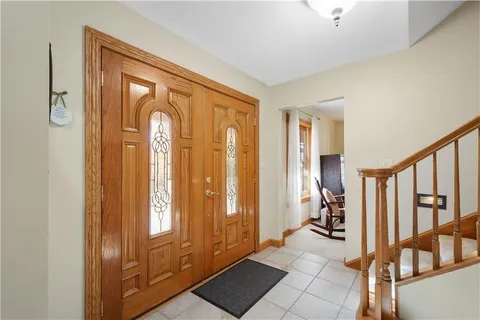 a view of a hallway with windows and stairs