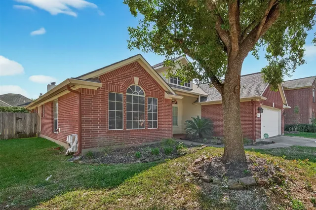 a kitchen with stainless steel appliances granite countertop a sink counter space cabinets and a large window