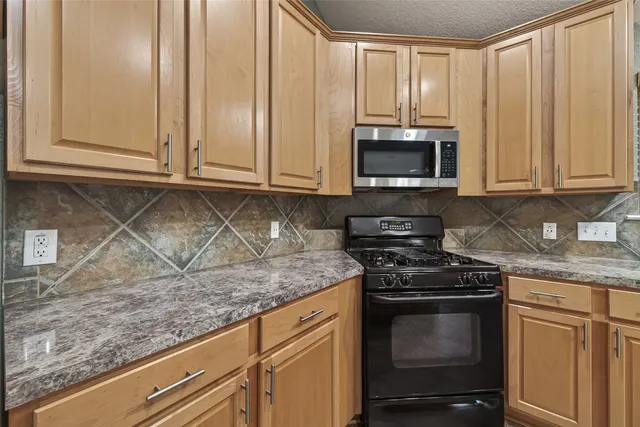 a view of wooden floor and windows in a room