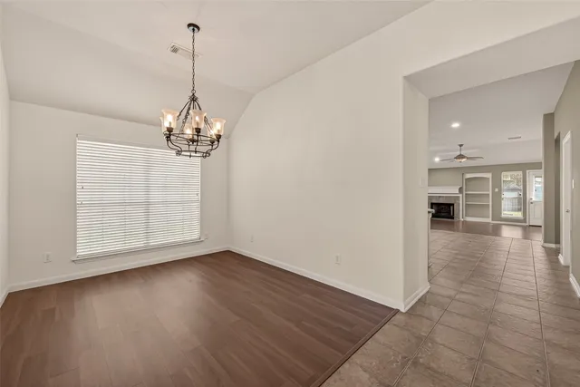 a kitchen with granite countertop a stove sink and cabinets