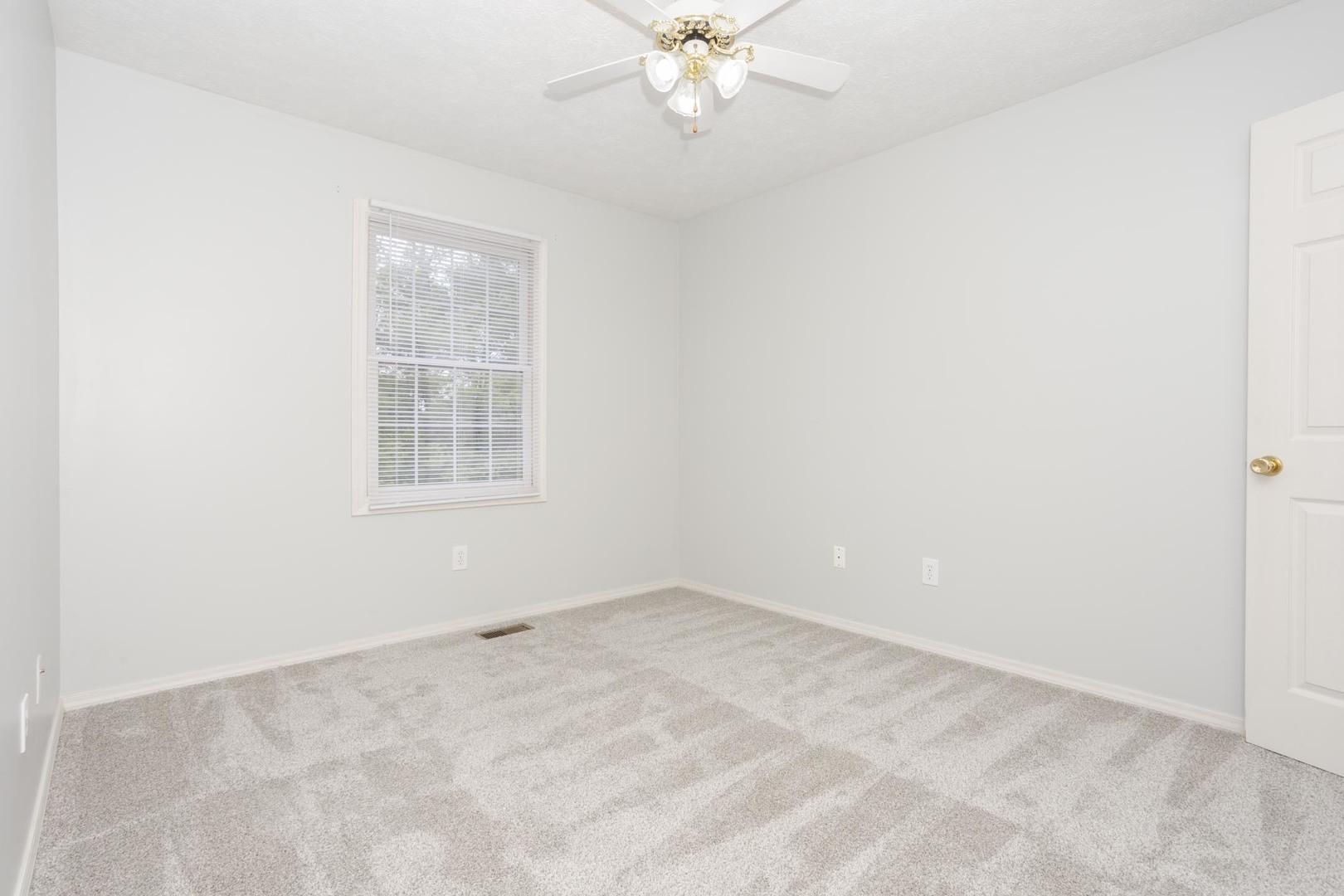 814 Landau Lane Normal, IL 61761 - Photo 38 of 58 an empty room with windows and fan