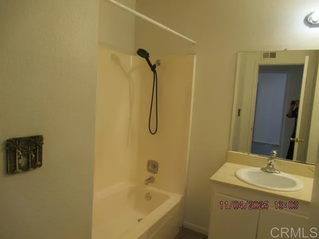 a bathroom with a sink and a bathtub