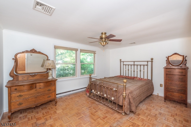 20 Wanaque Road West Milford, NJ 07421 - Photo 12 of 31 a bedroom with a bed and large windows