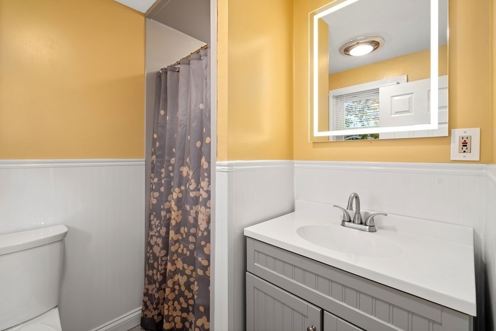 5 Myrtle Street Mendon, MA 01756 - Photo 14 of 22 a bathroom with a sink a vanity and a shower
