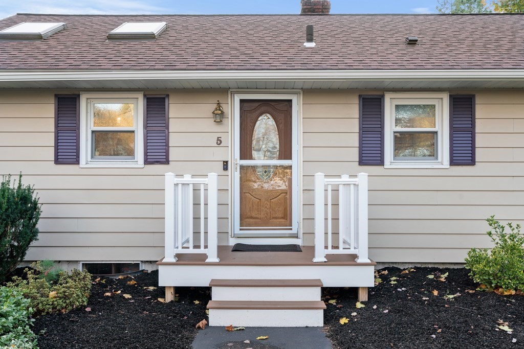 5 Myrtle Street Mendon, MA 01756 - Photo 2 of 22 a front view of a house with a garden
