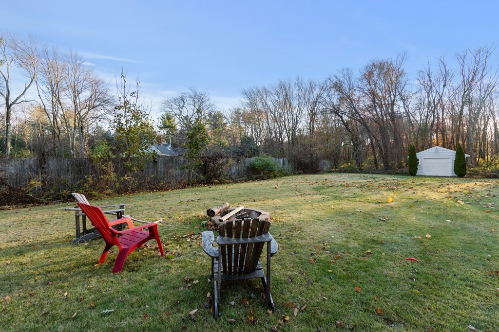 5 Myrtle Street Mendon, MA 01756 - Photo 22 of 22 a view of a bench in the middle of a garden