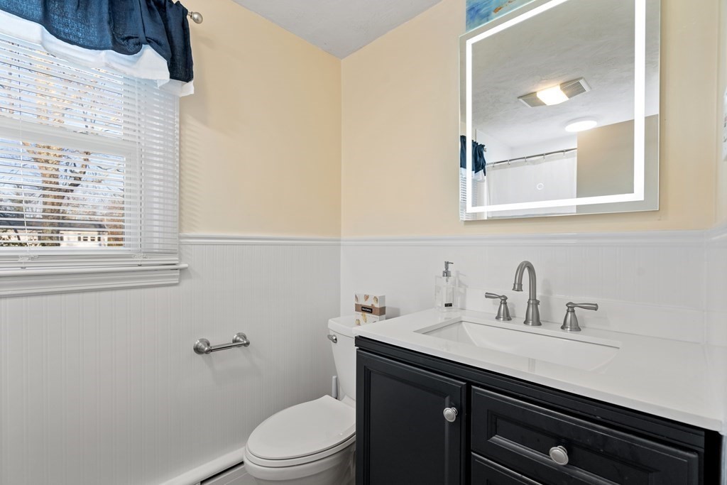 5 Myrtle Street Mendon, MA 01756 - Photo 10 of 22 a bathroom with a sink a toilet and a mirror