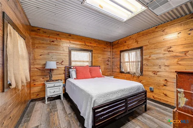 a dining room with furniture window and wooden floor