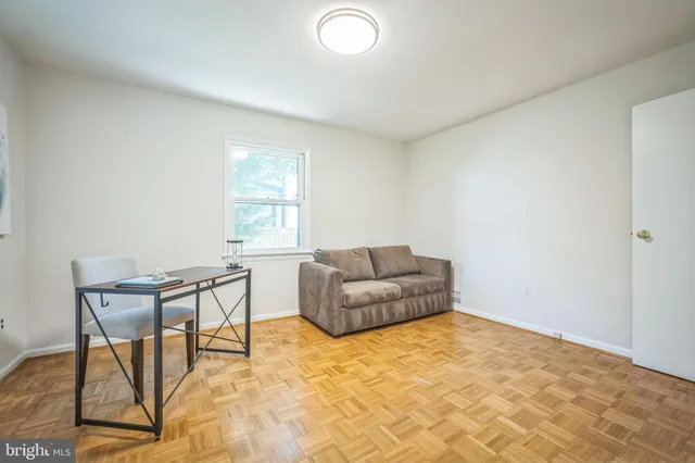 a living room with a couch and a window