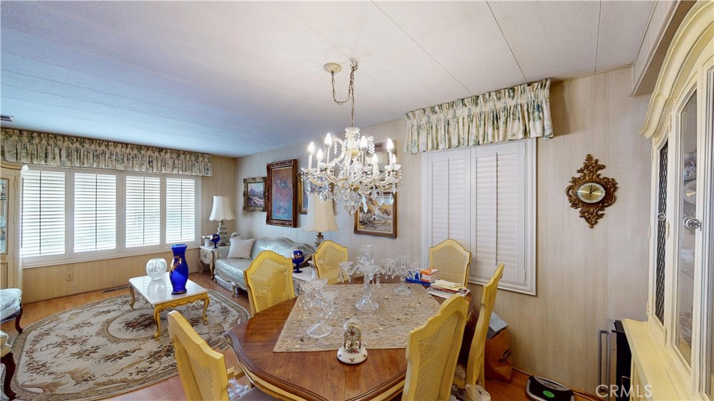 14851 Jeffrey Road, Unit 117 Irvine, CA 92618 - Photo 15 of 45 a living room with furniture and a chandelier