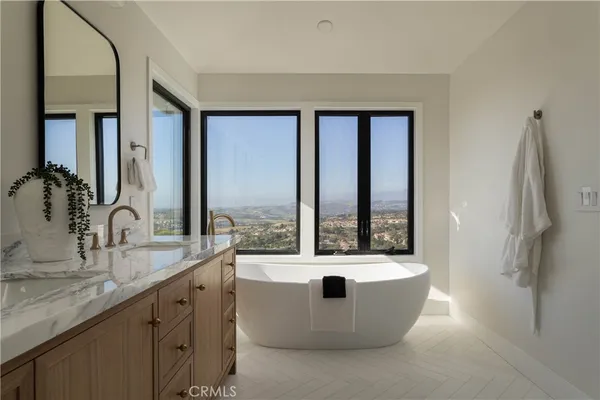 a bathroom with a toilet tub and shower