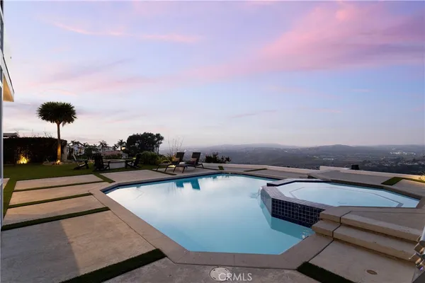 front view of a house with a swimming pool