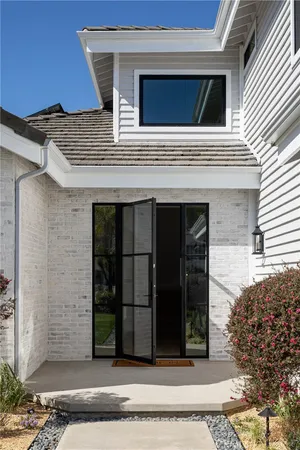 a view of living room with furniture and floor to ceiling window