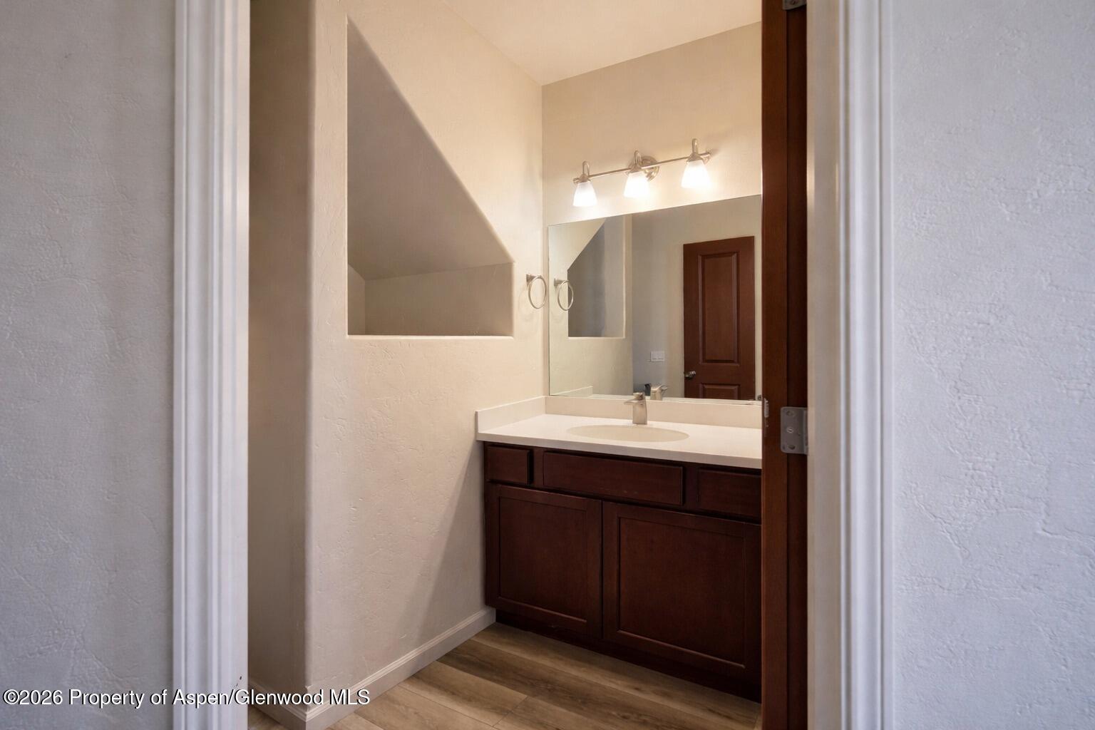 1648 Arabian Avenue Rifle, CO 81650 - Photo 4 of 15 a bathroom with a sink and mirror