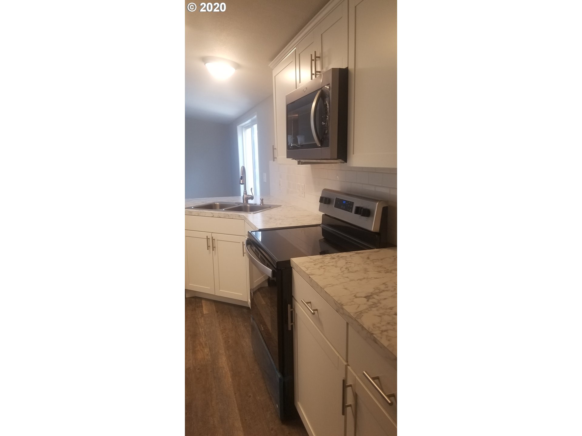 812 Southwest 12th Street Pendleton, OR 97801 - Photo 15 of 32 a kitchen with a sink and cabinets
