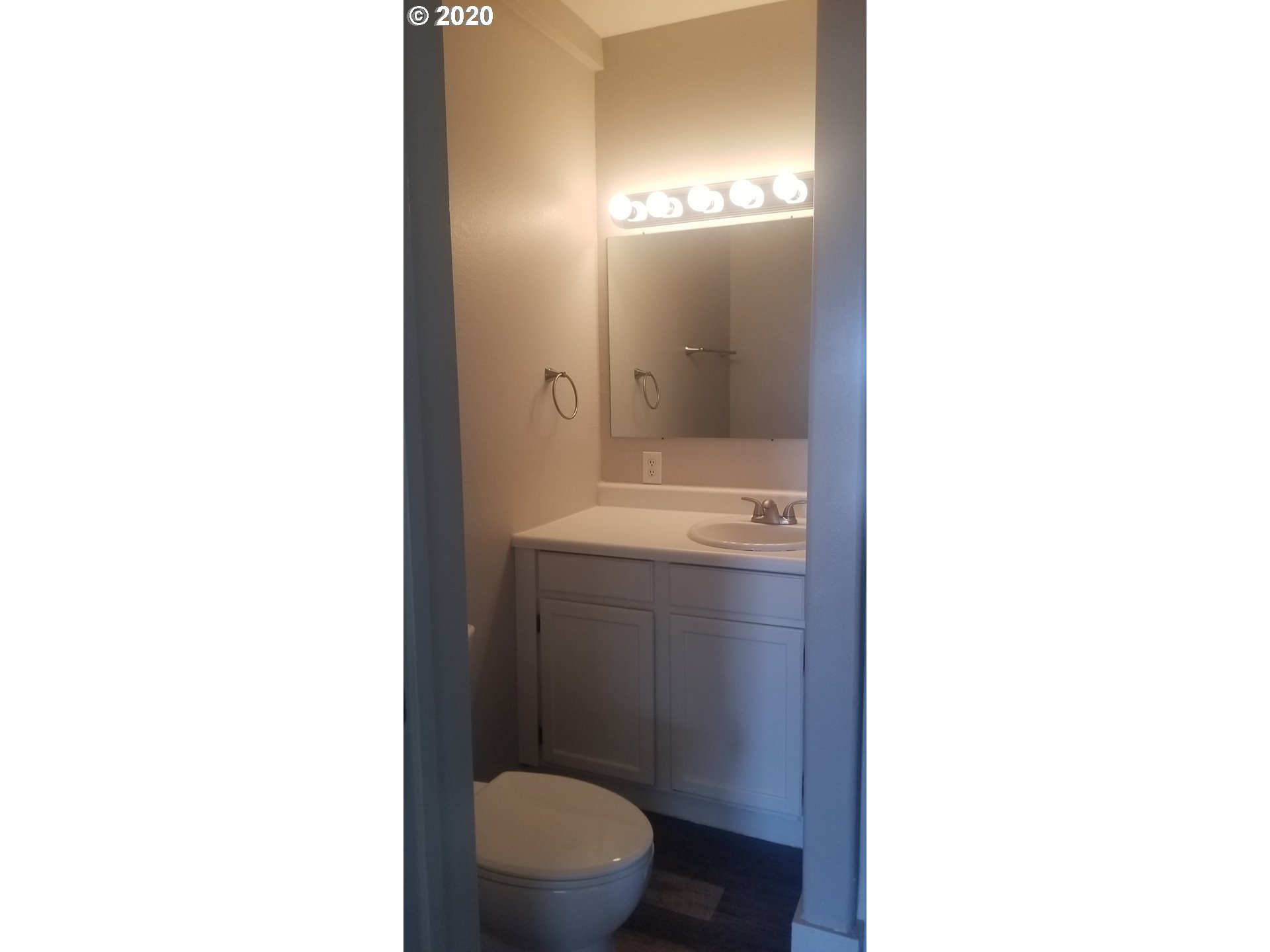 812 Southwest 12th Street Pendleton, OR 97801 - Photo 32 of 32 a bathroom with a sink a toilet a mirror and vanity