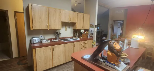 a kitchen with a sink appliances and cabinets