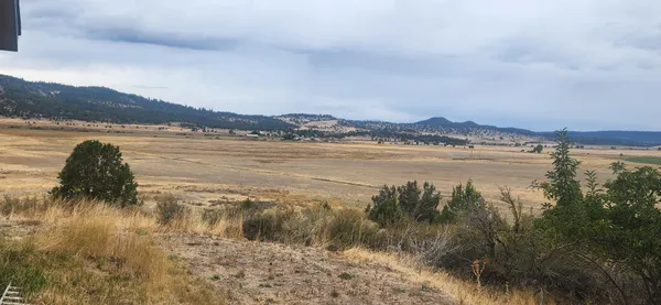 a view of lake with mountain in the back