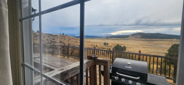 a view of a balcony with an ocean view