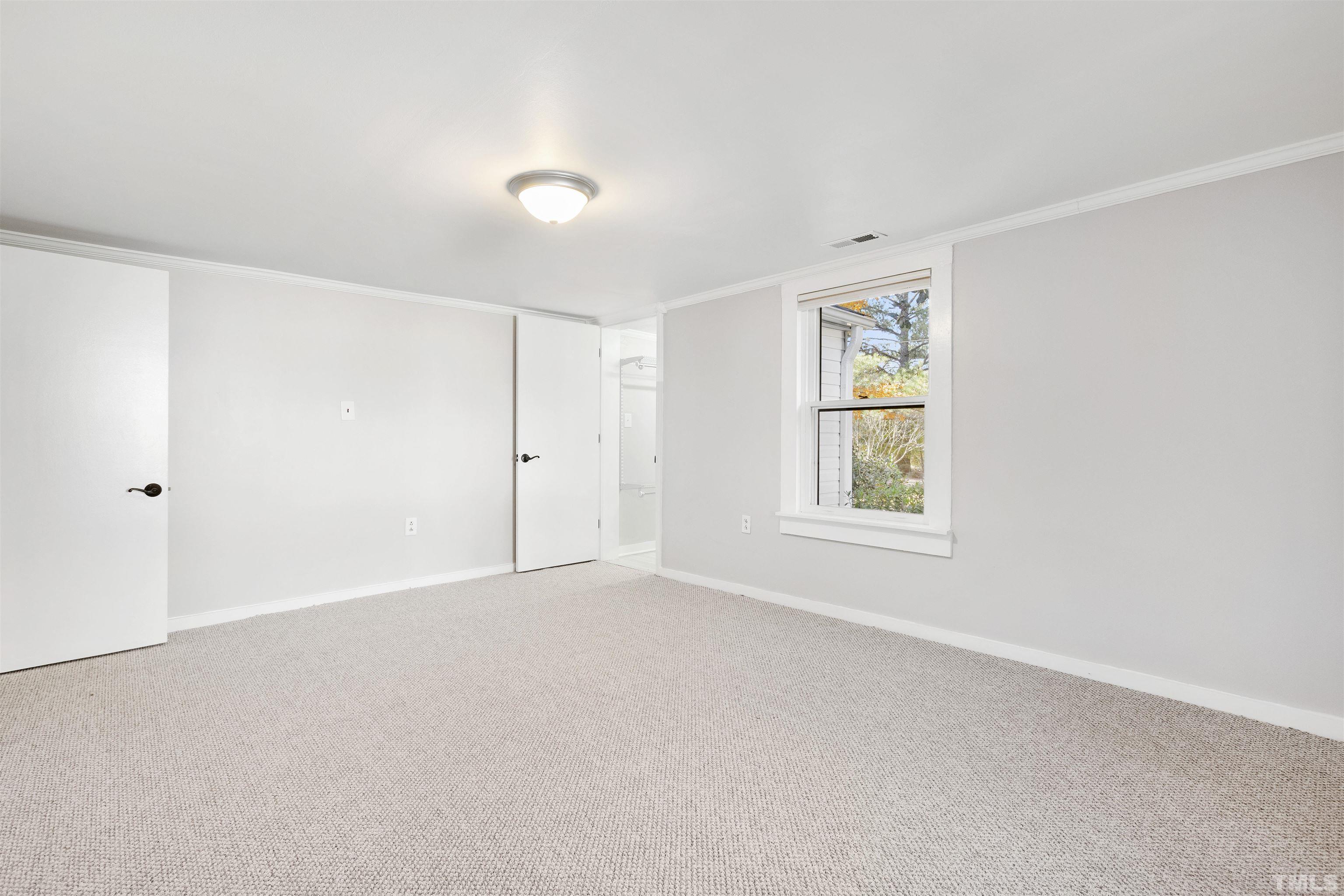 5524 Bobbitt Road Apex, NC 27539 - Photo 14 of 24 a view of an empty room with a window