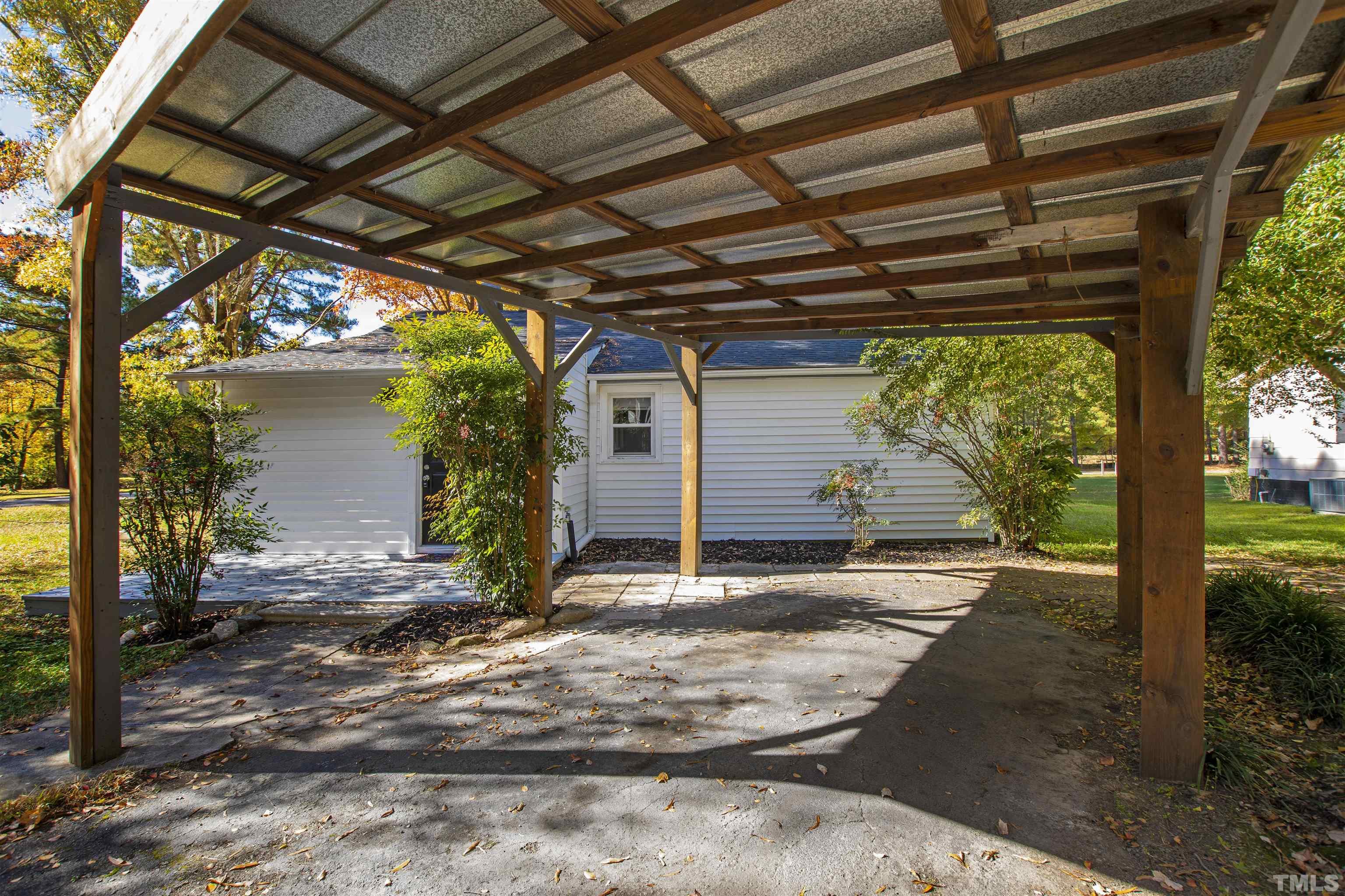 5524 Bobbitt Road Apex, NC 27539 - Photo 22 of 24 a view of backyard with large tree