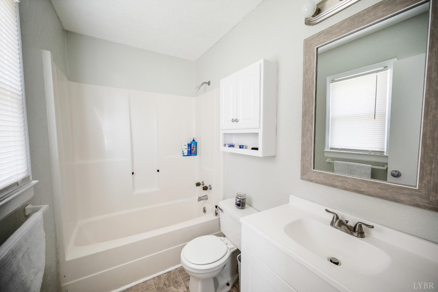 2050 Hawkins Mill Road Lynchburg, VA 24503 - Photo 15 of 32 a bathroom with a bathtub shower sink vanity mirror and toilet