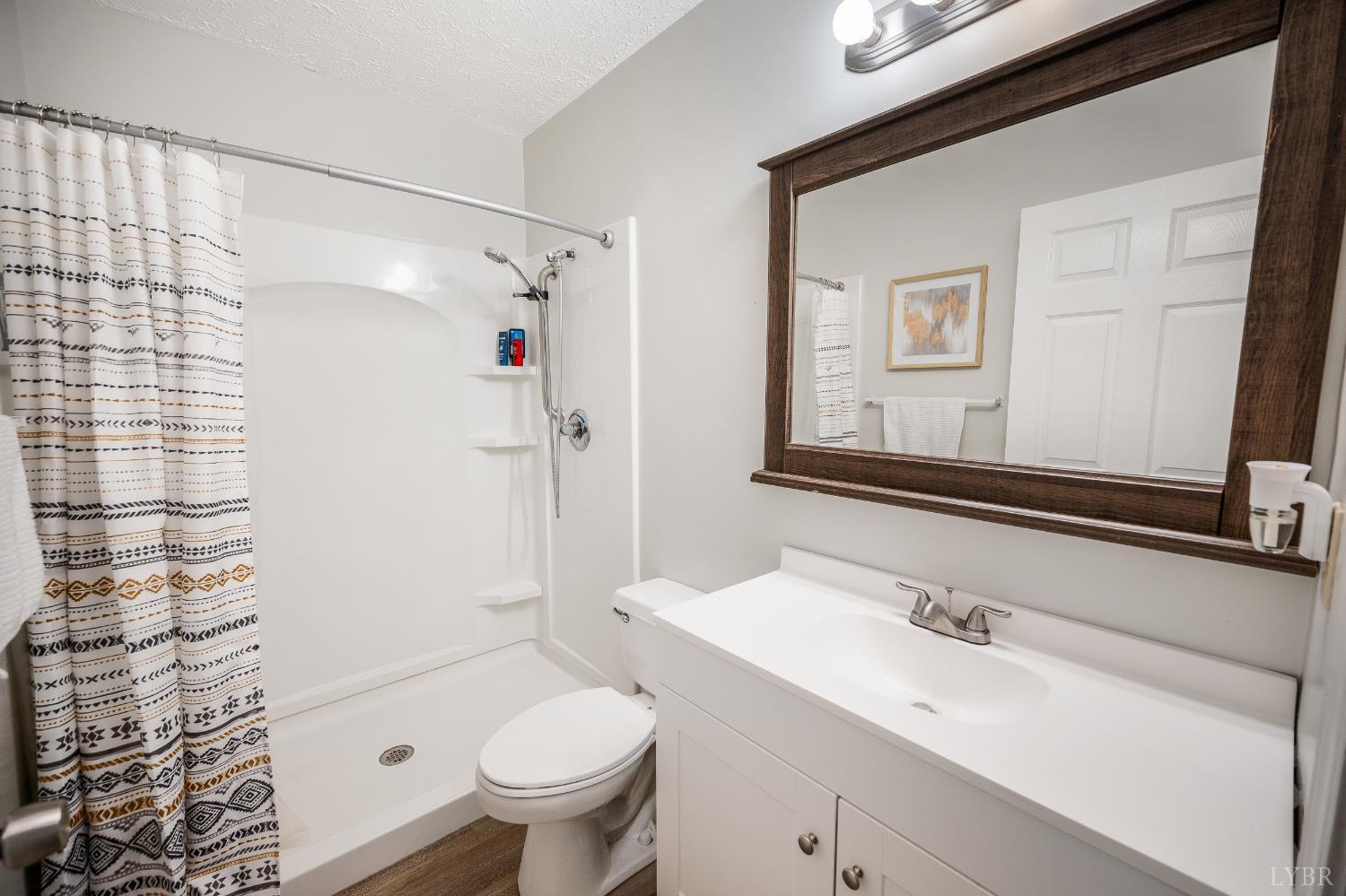 2050 Hawkins Mill Road Lynchburg, VA 24503 - Photo 19 of 32 a bathroom with a sink toilet and shower