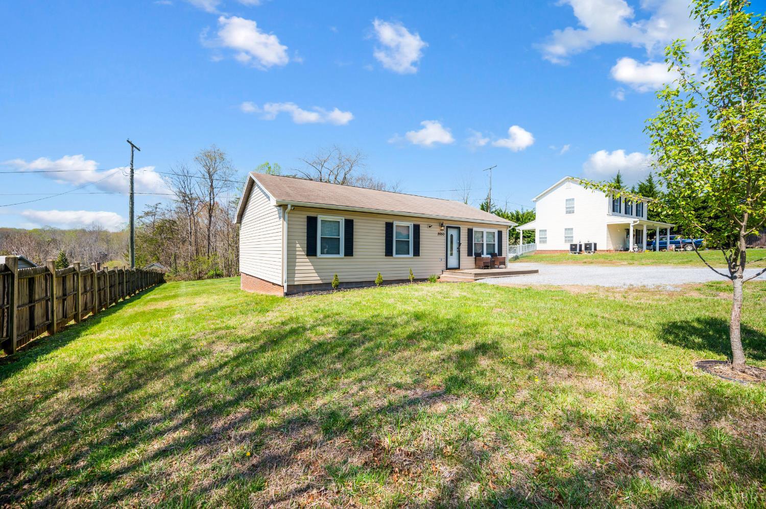 2050 Hawkins Mill Road Lynchburg, VA 24503 - Photo 2 of 32 a front view of a house with a yard