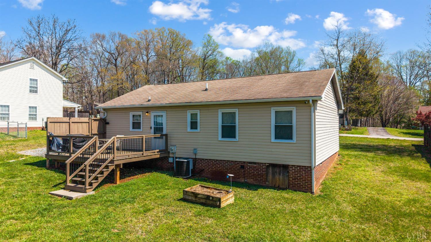 2050 Hawkins Mill Road Lynchburg, VA 24503 - Photo 23 of 32 a view of a house with a yard chairs and table in the patio