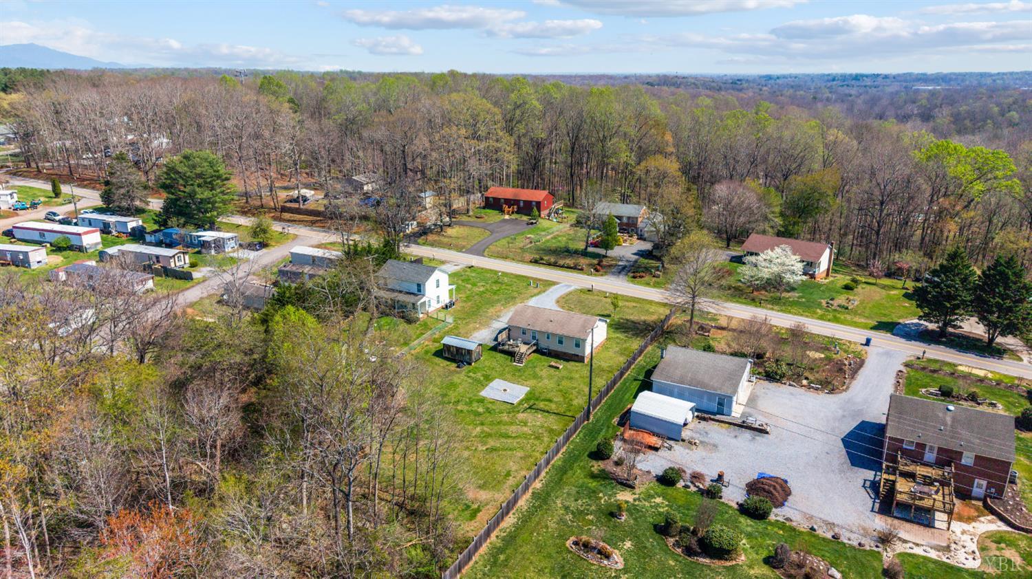 2050 Hawkins Mill Road Lynchburg, VA 24503 - Photo 28 of 32 an aerial view of a house with a garden and lake view